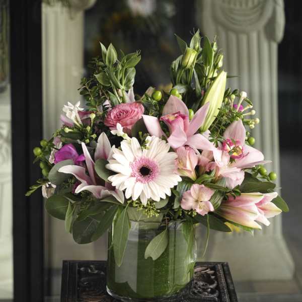 Pink and white mixed bouquet in a glass vase