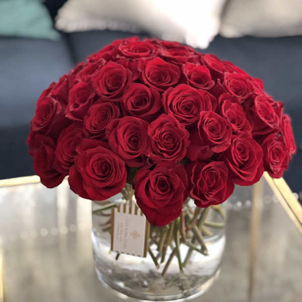 Bouquet of red roses in a clear glass vase