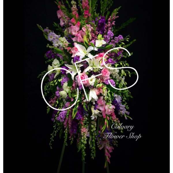 Tall standing floral spray with pink, purple, and white flowers