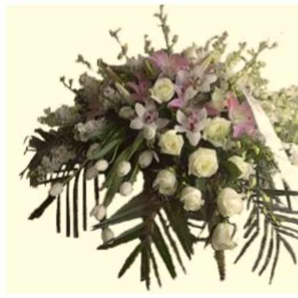 Large bouquet of white and pink flowers with trailing greenery