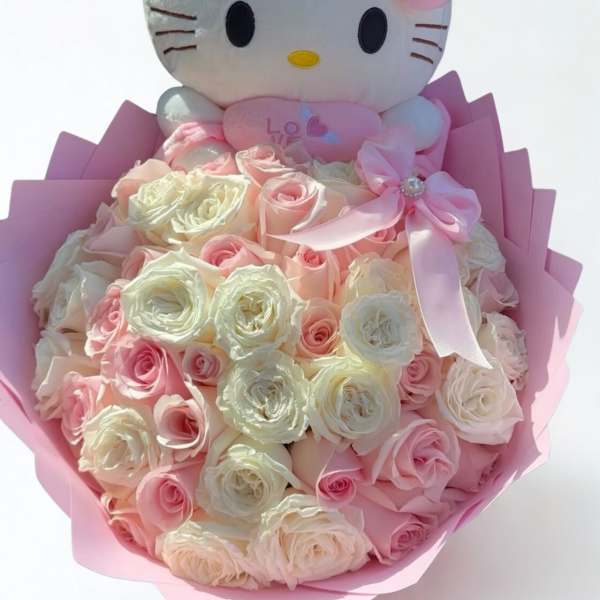 Hello Kitty plush above a bouquet of pink and white roses