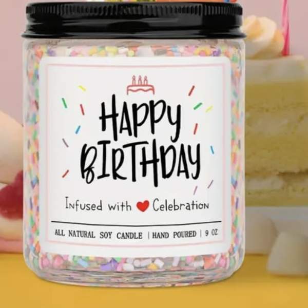 Birthday candle in a glass jar with a black lid