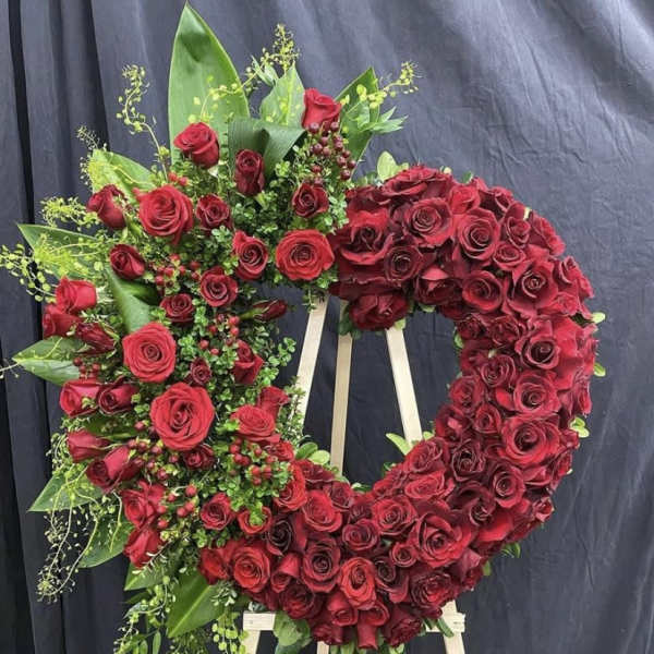 Large red rose wreath on a standing easel