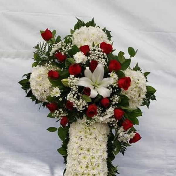 Standing floral spray with red roses, white lilies, and white chrysanthemums