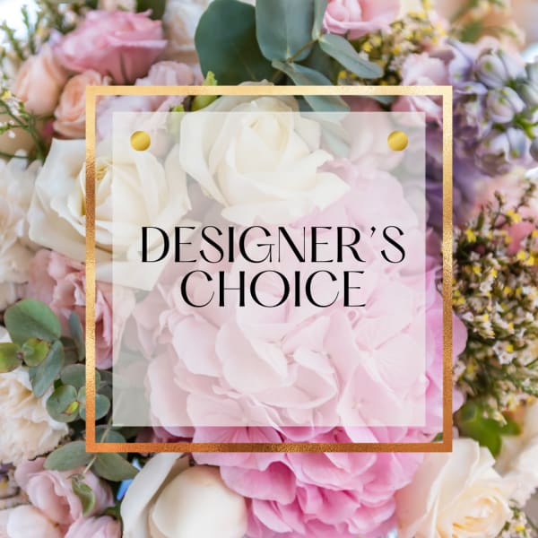 Pastel designer’s choice arrangement with pink hydrangeas and white and blush roses behind a text overlay.