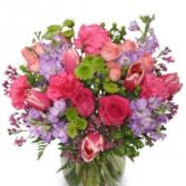 Pink and purple mixed bouquet in a clear glass vase