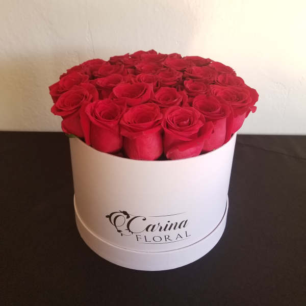 Round box of red roses