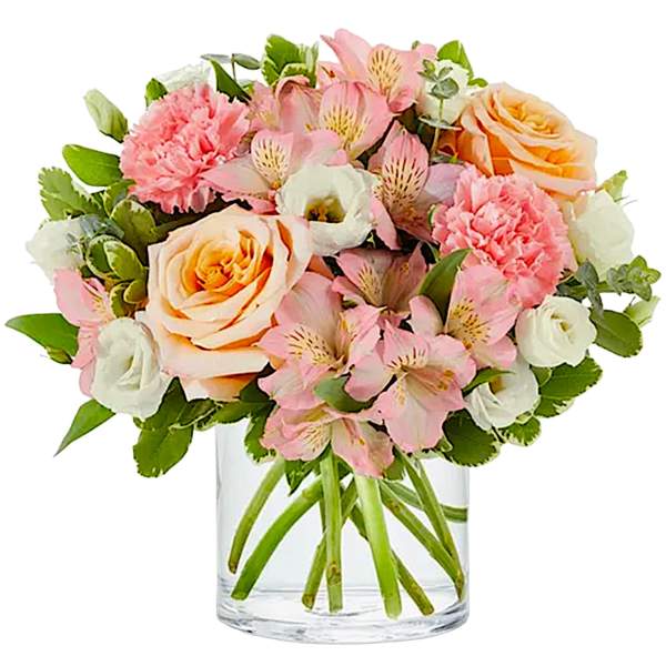 Pink and peach bouquet in a clear glass vase
