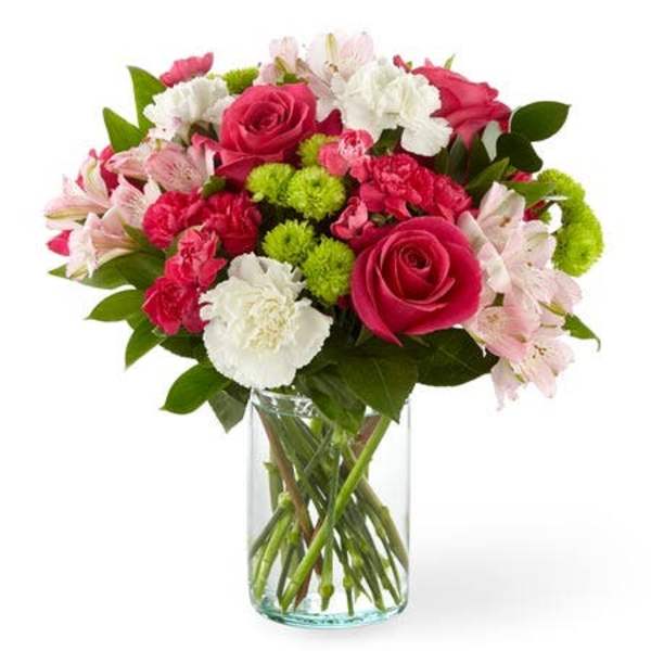 Mixed pink and white bouquet in a clear glass vase