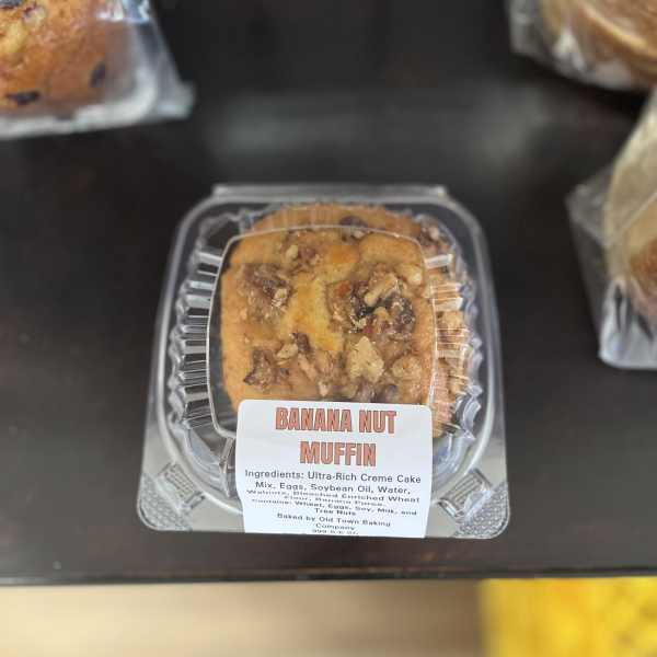 Banana nut muffin in a clear plastic clamshell container