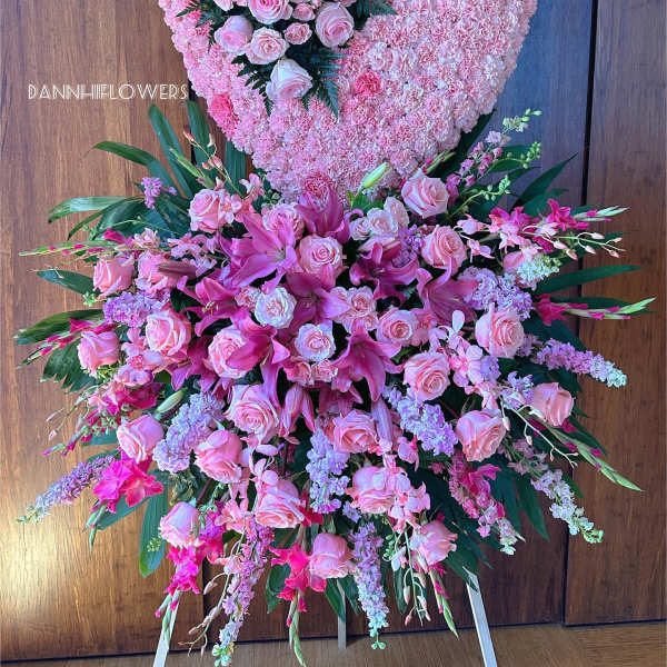 Large pink floral heart and standing spray with roses and lilies