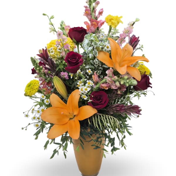 Mixed bouquet with orange lilies, burgundy roses, and yellow flowers in a vase