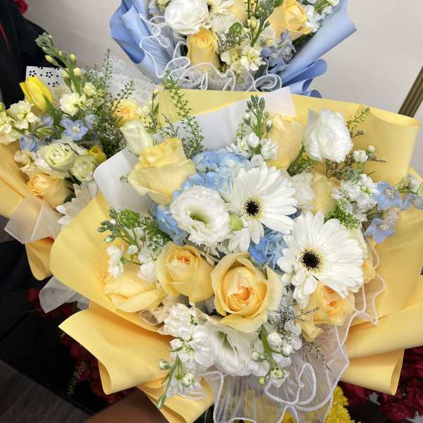 Florist Choice- Yellow & Blue Wrapped bqt
