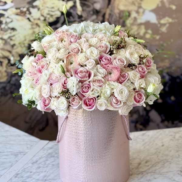 Pink and white rose bouquet in a pale pink hat box