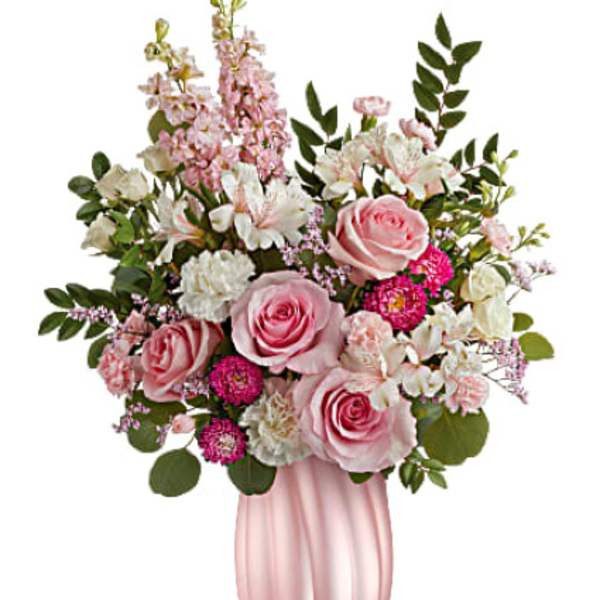 Pink roses and white flowers in a pink vase