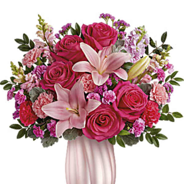 Pink rose and lily bouquet in a pale pink vase