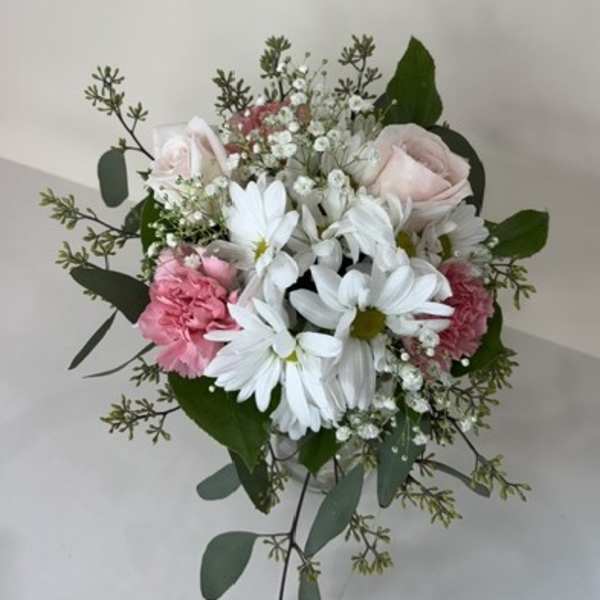 Bouquet of white daisies, pale pink roses, and pink carnations