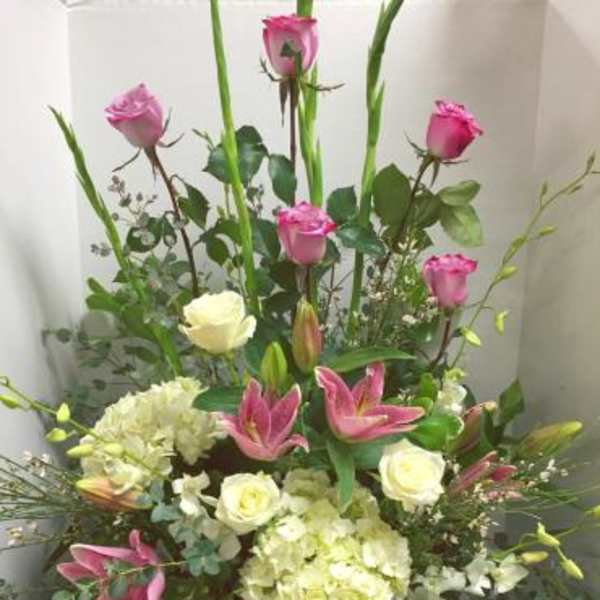 Tall bouquet with pink roses, lilies, and white hydrangeas