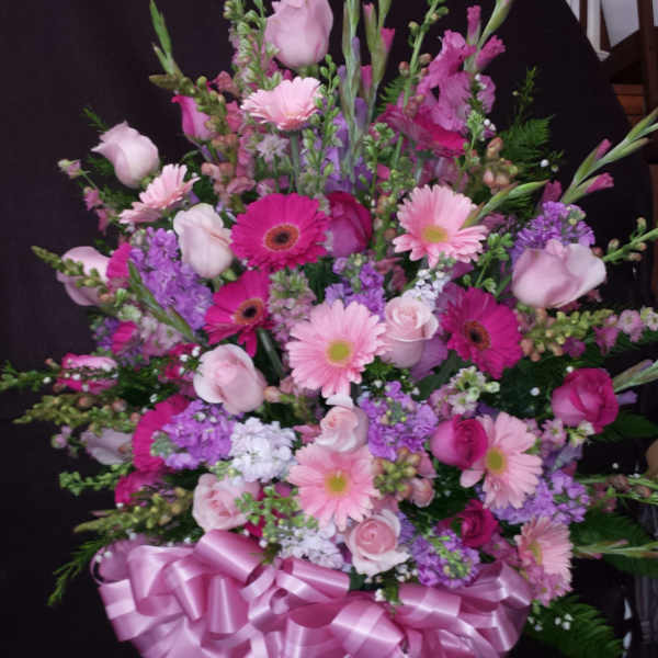 Large pink and purple mixed bouquet with a satin ribbon bow