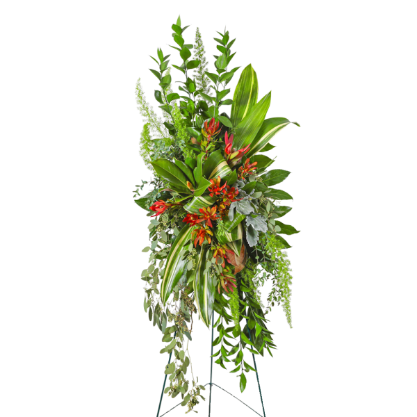 Tall tropical floral standing spray with red-orange blooms and mixed greenery
