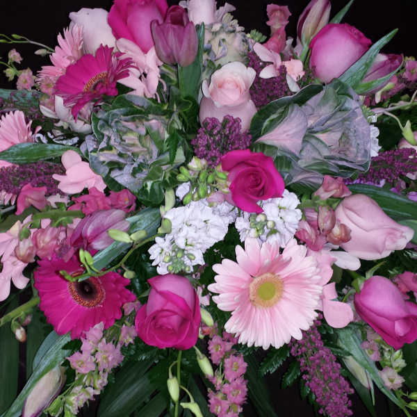 Pink mixed flower arrangement with roses and gerbera daisies