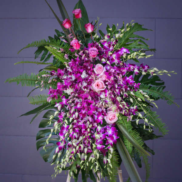 Standing floral spray with pink roses and purple orchids