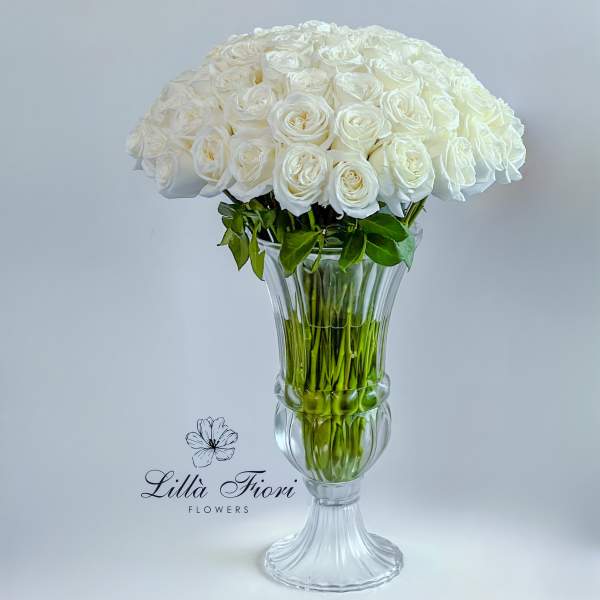 White rose bouquet in a clear glass vase