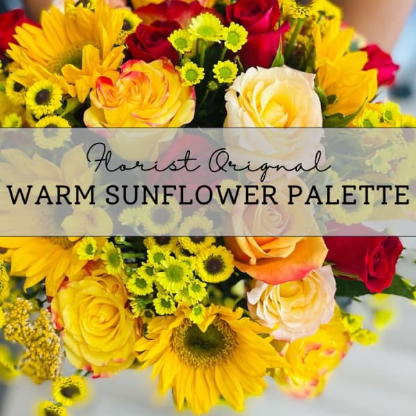 Mixed bouquet with sunflowers, roses, and small yellow daisies