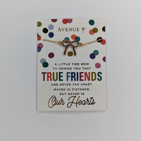 Friendship card with a jeweled bow necklace on the front