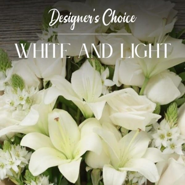White lilies and small white flowers in a bouquet