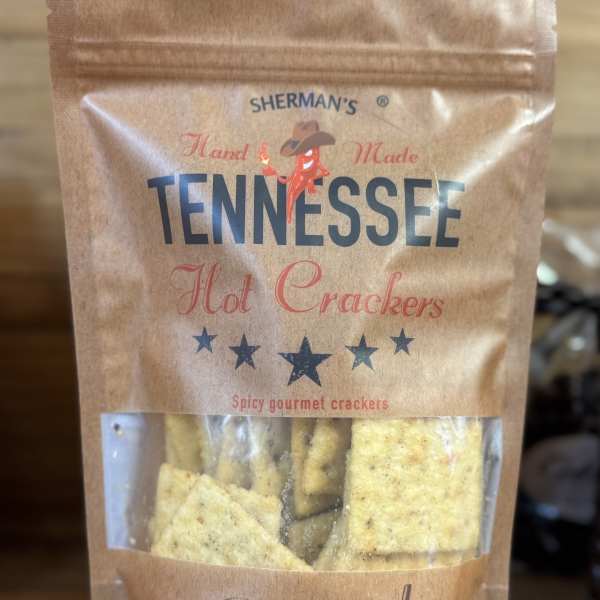 A bag of Sherman’s Tennessee hot crackers on a wooden surface.