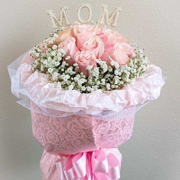 Pink rose bouquet with baby's breath and a MOM topper