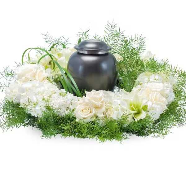 White floral wreath around a dark urn-shaped container