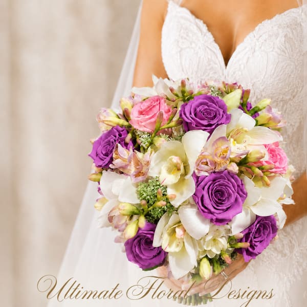 Bride holding a bouquet of purple roses and white orchids