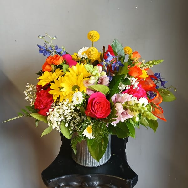 Colorful mixed bouquet in a ribbed metal container