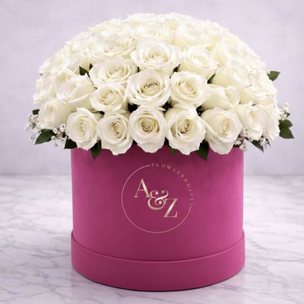 White rose bouquet in a pink round box