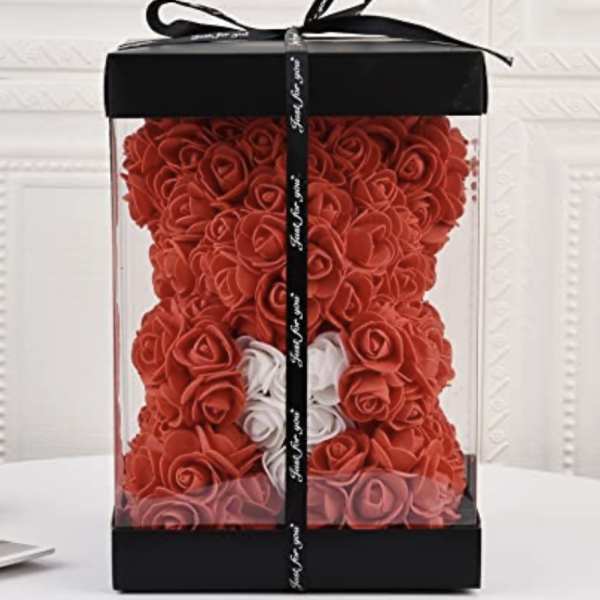 Red rose teddy bear in a clear gift box with a black ribbon