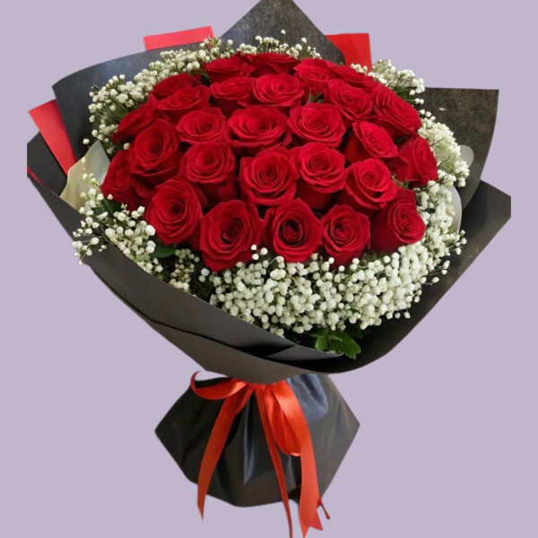 Bouquet of red roses with white baby's breath wrapped in black paper