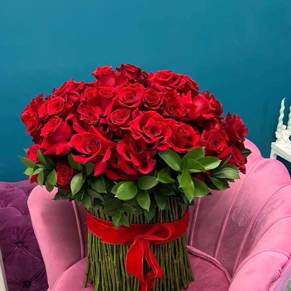 Large bouquet of red roses with a red ribbon