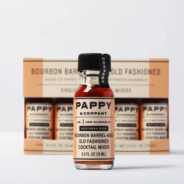 Bottle of non-alcoholic old fashioned cocktail mixer in front of a boxed set