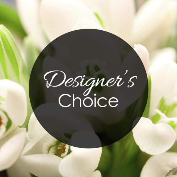 White tulips with a "Designer’s Choice" label