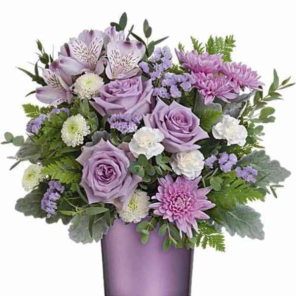Lavender and pink bouquet in a purple glass vase