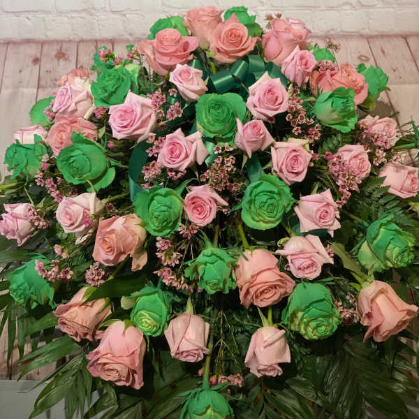 Large bouquet of pink and green roses with ribbon
