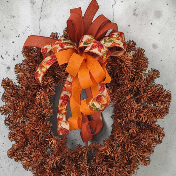 Autumn wreath with orange and brown ribbon bow