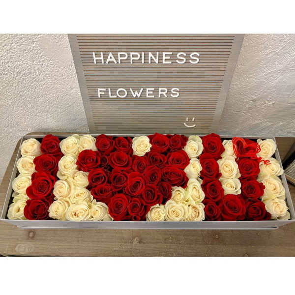 Box of red and white roses arranged in a heart shape