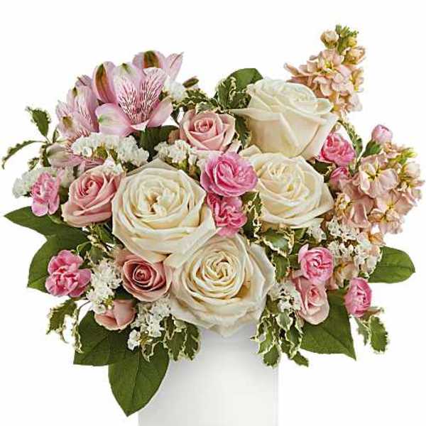 Pink and white rose bouquet in a white vase