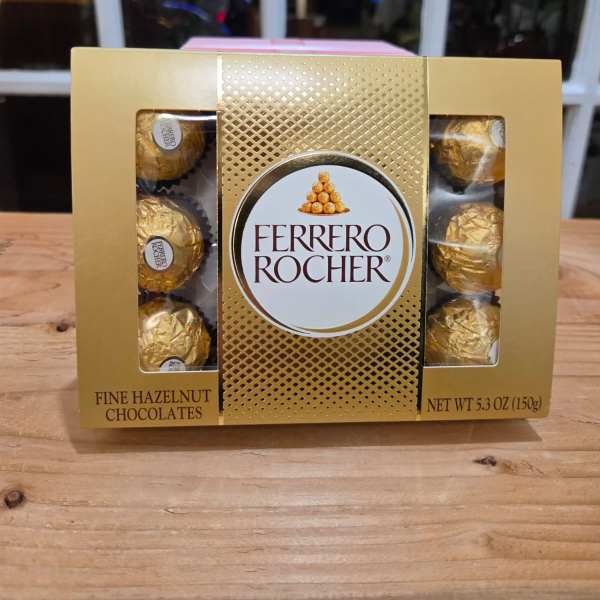 Box of Ferrero Rocher chocolates on a wooden table