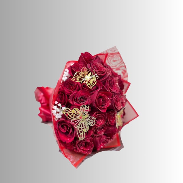 Bouquet of red roses wrapped in red paper with butterfly decorations