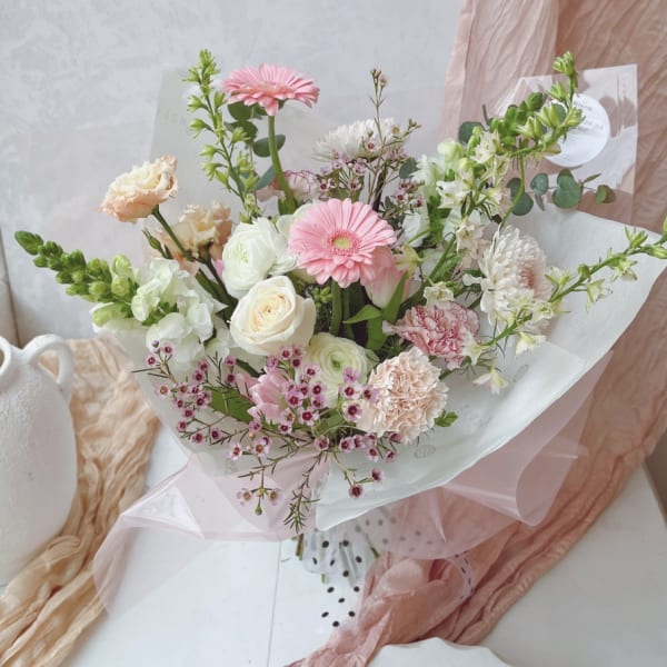 Pink and white mixed bouquet with roses and gerbera daisies