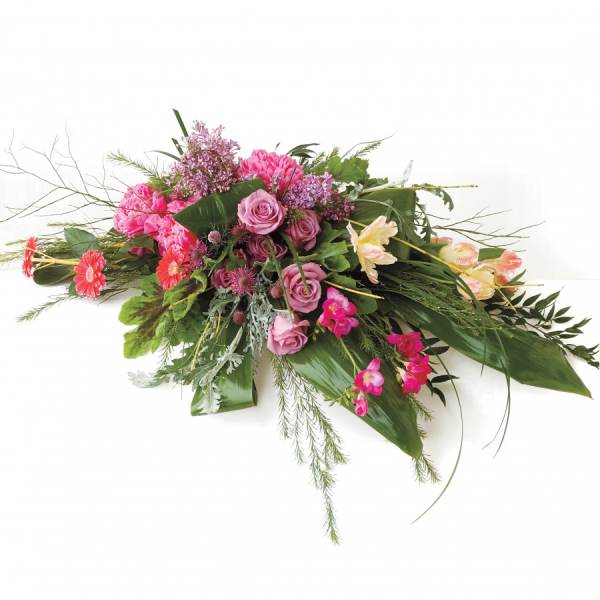 Pink and lavender floral arrangement with roses and mixed blooms